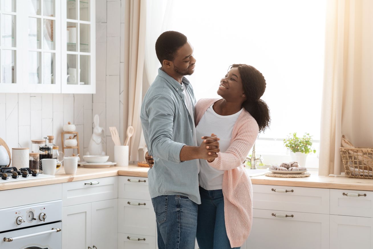 man dancing with woman after receiving implantable hearing aids